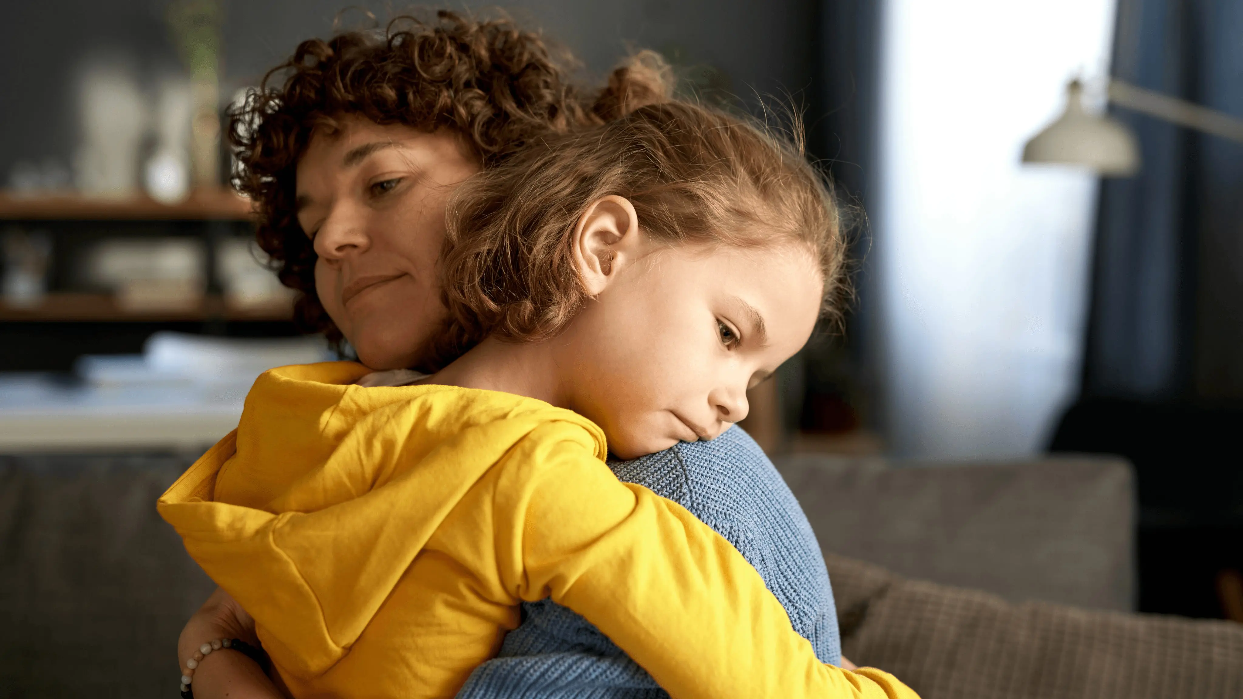 Child hugging their mother, offering comfort and support during a moment of big emotions, reflecting the theme of helping kids handle and express their feelings.