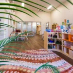 Vibrant and inviting indoor space at Buttercups Perth Childcare, featuring engaging play areas, educational resources, and creative learning stations designed to inspire curiosity and foster development in a nurturing environment.