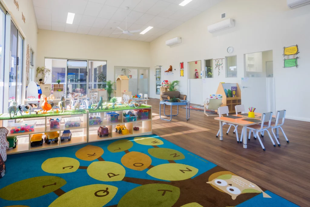 Bright and engaging indoor learning space at Buttercups Perth Childcare, featuring interactive play areas, educational resources, and cosy seating, designed to foster creativity, exploration, and early development in a nurturing environment.