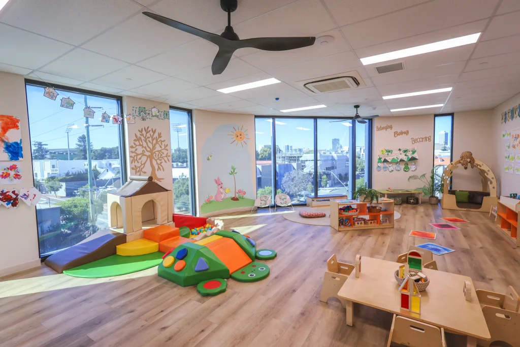 Buttercups Perth Childcare North Perth nursery room featuring a bright, engaging space with large windows, age-appropriate toys, soft play equipment, and cosy reading corners for infants.