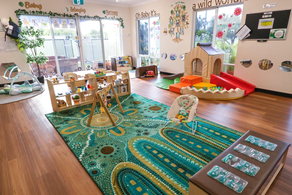 Buttercups Perth Childcare Hammond Park nursery room featuring a bright, engaging space with large windows, age-appropriate toys, soft play equipment, and cosy reading corners for infants.