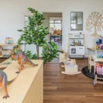 Indoor learning and play area at a Perth childcare centre, featuring creative play stations, educational toys, and a welcoming environment for children.