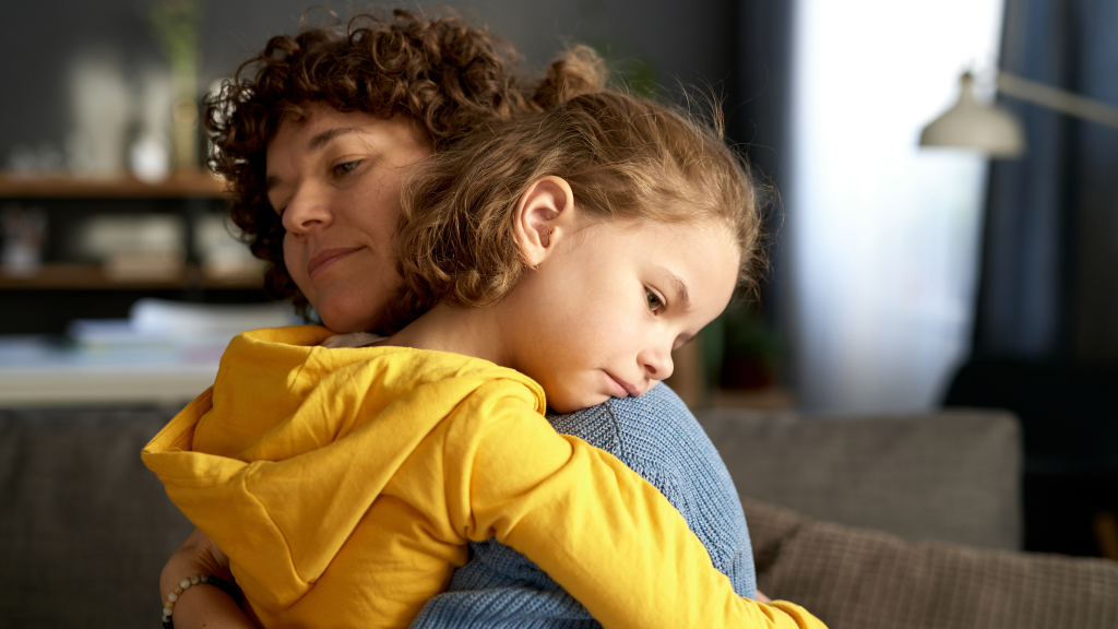 Child hugging their mother, offering comfort and support during a moment of big emotions, reflecting the theme of helping kids handle and express their feelings.