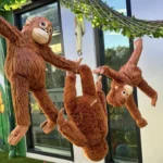 Three plush monkeys hang playfully from a vine at Buttercups Perth Childcare, enhancing the jungle-themed learning space.