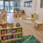 Engaging indoor play space at Buttercups Perth Childcare, featuring cosy reading nooks, sensory play stations, and interactive learning areas designed to foster creativity, exploration, and social development in a warm and inviting environment.