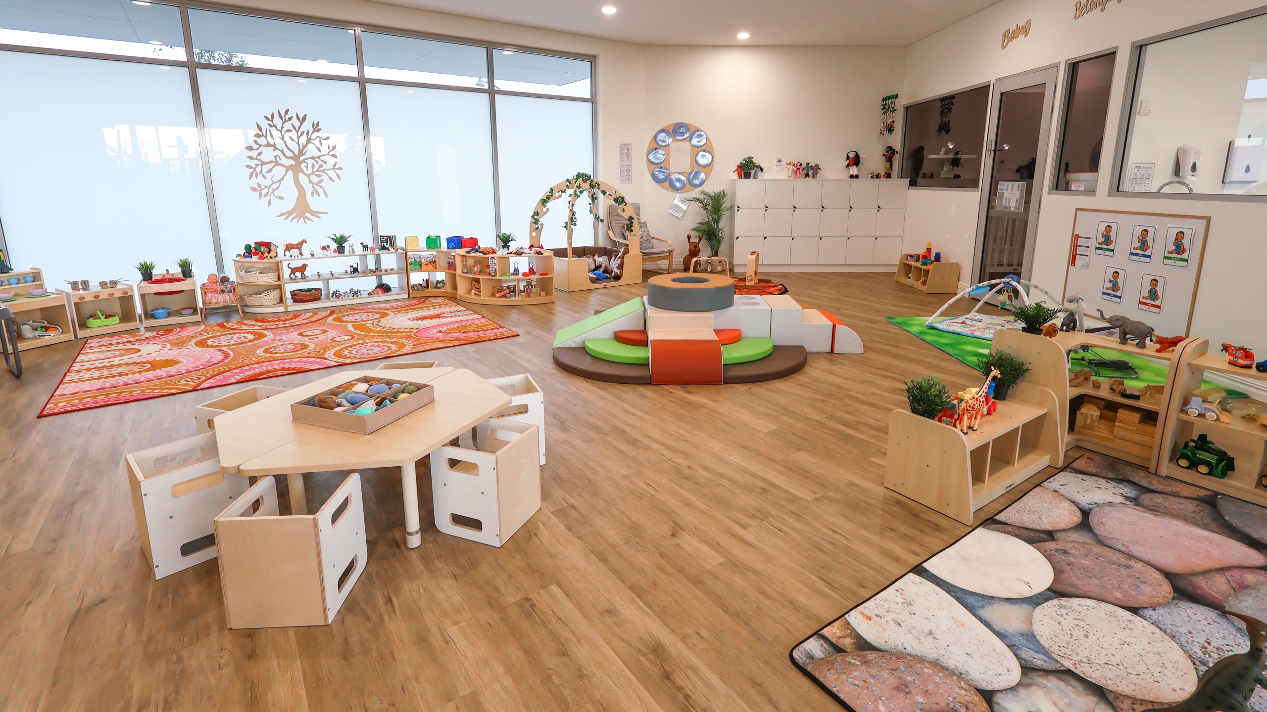 Buttercups Perth Childcare Eglinton nursery room featuring a bright, engaging space with large windows, age-appropriate toys, soft play equipment, and cosy reading corners for infants.