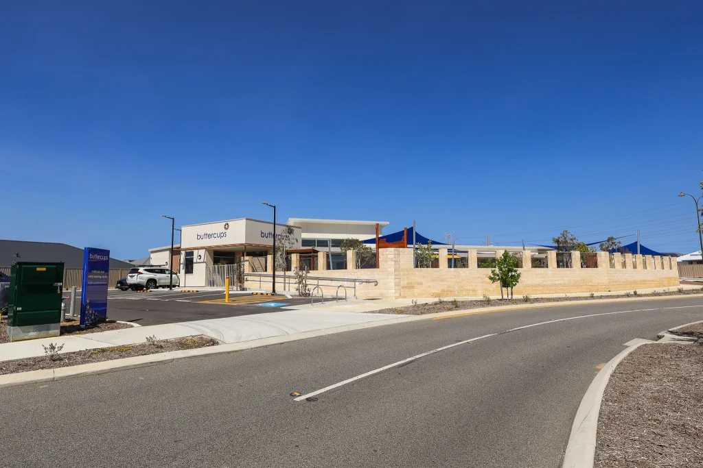 Exterior view of Buttercups Perth Childcare and Early Learning Centre, featuring a vibrant sign with the logo.