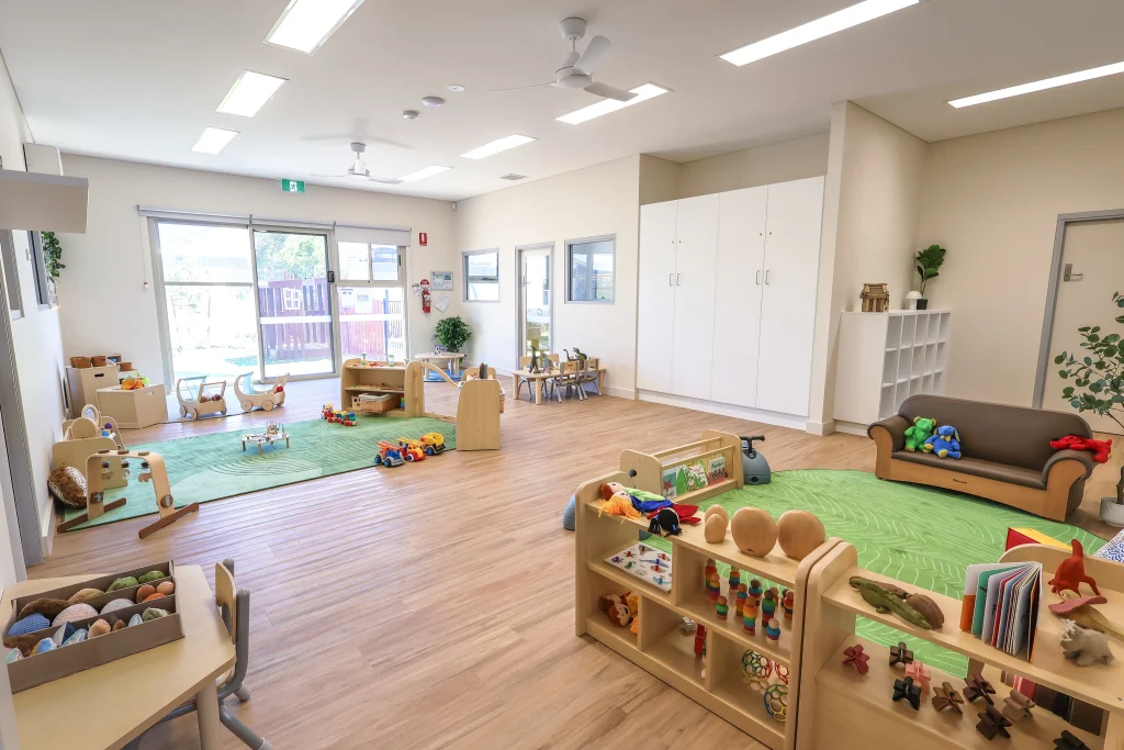 Engaging indoor play space at Buttercups Perth Childcare, featuring cosy reading nooks, sensory play stations, and interactive learning areas designed to foster creativity, exploration, and social development in a warm and inviting environment.