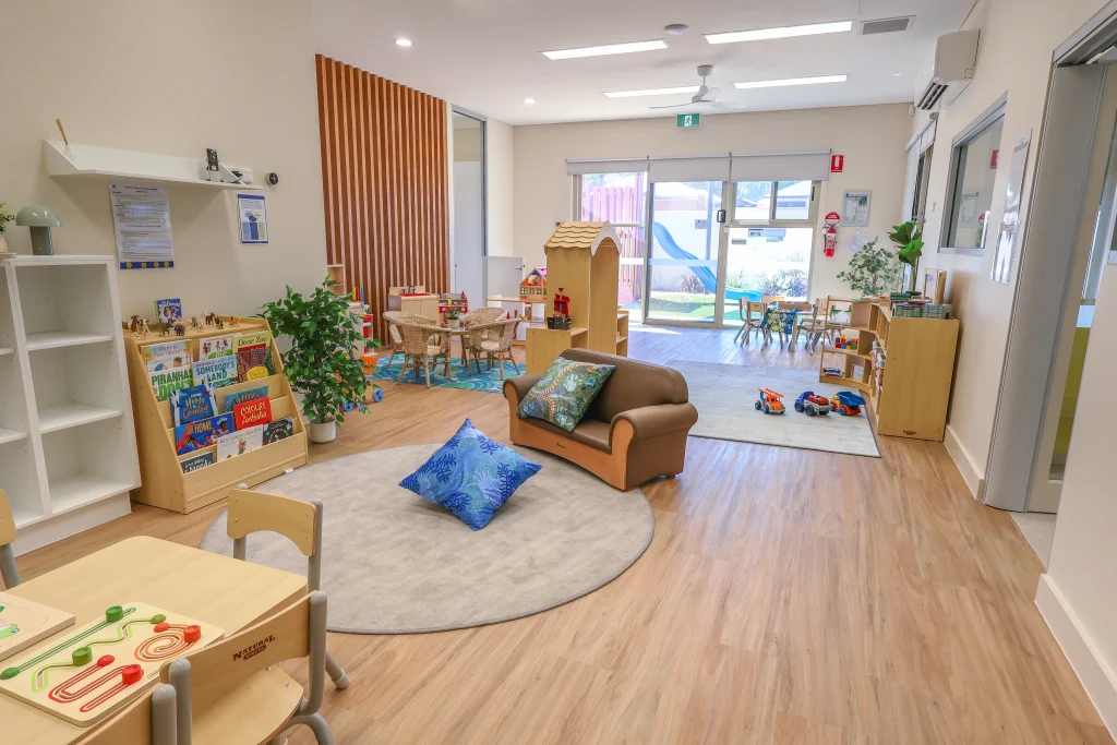Bright and engaging indoor learning space at Buttercups Perth Childcare, featuring interactive play areas, educational resources, and cosy seating, designed to foster creativity, exploration, and early development in a nurturing environment.